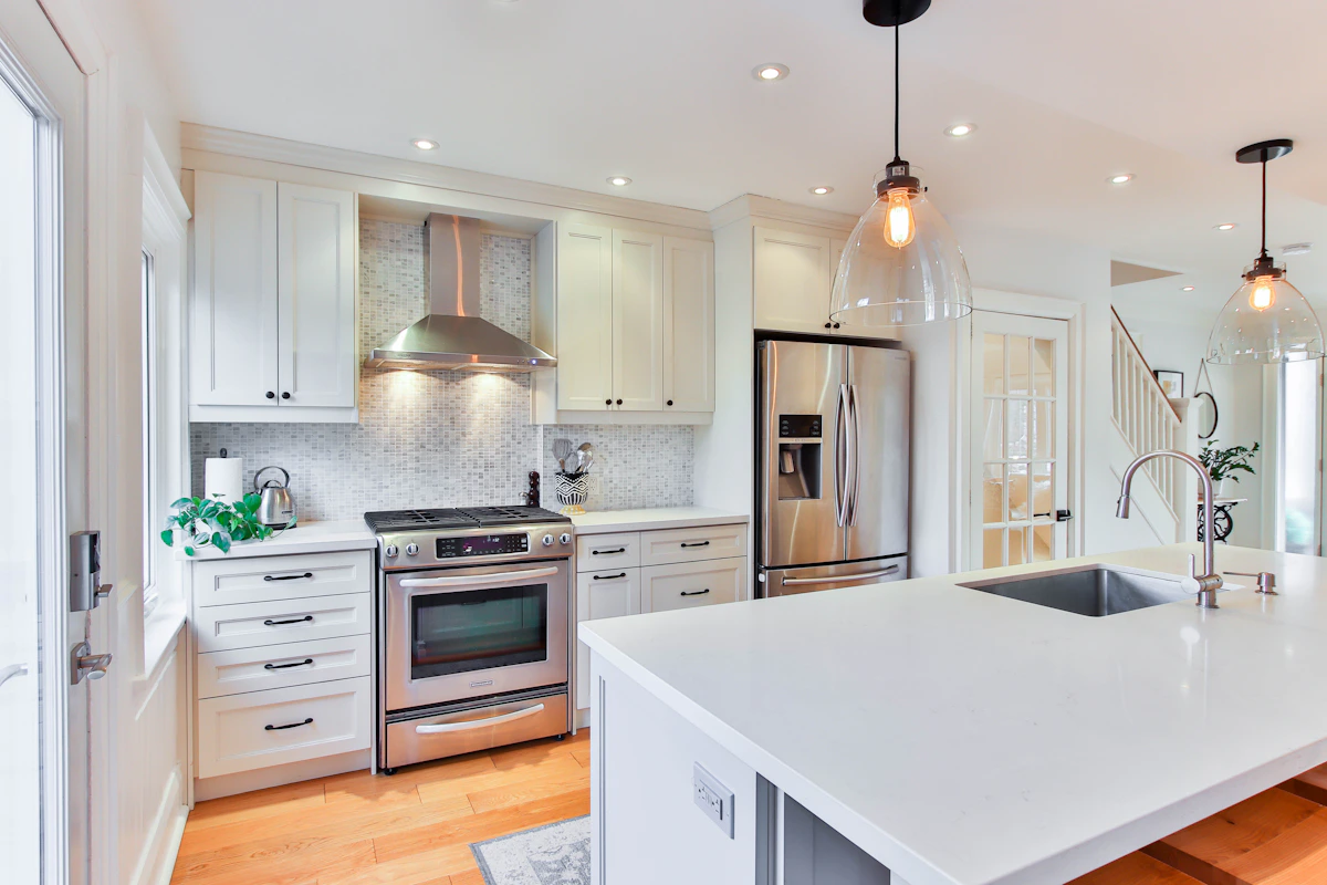 Illustrative white kitchen cabinetry, not a completed Lowell's project.